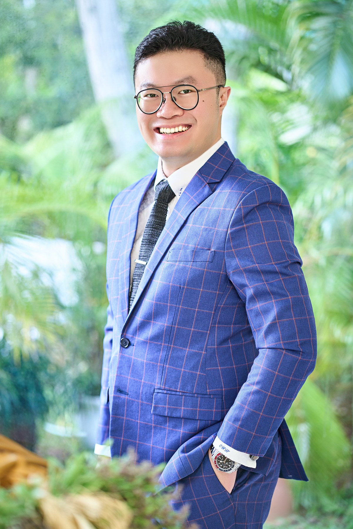 Dr Chung Wing Hong in a blue checked suit